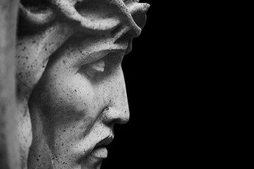 Close up Jesus Christ crown of thorns. Fragment of an ancient stone statue.