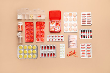 Different pills on color background