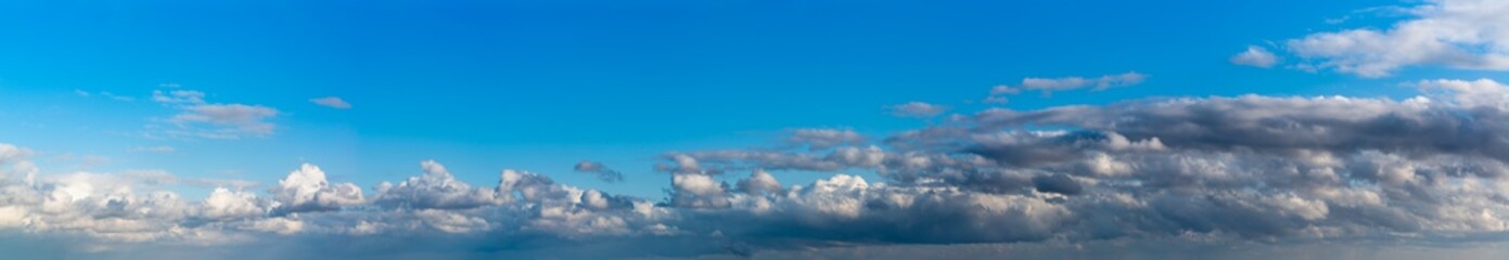 Fantastic clouds against blue sky, panorama © StepStock