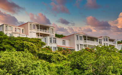 Fototapeta na wymiar Resort homes on green hillsdie in the tropics