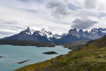 
Snow covered mountains with the light blue ocean in front in Torres del Paine National Park in Chile, Patagonia
