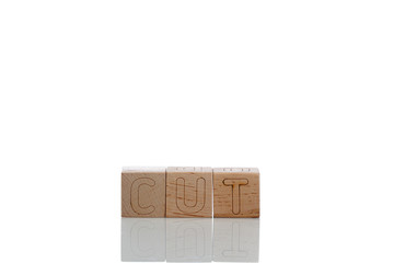 Wooden cubes with letters cut on a white background