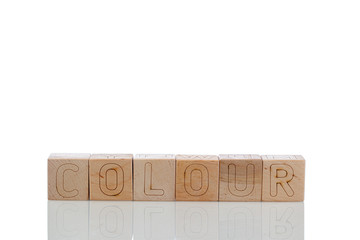 Naklejka premium Wooden cubes with letters colour on a white background