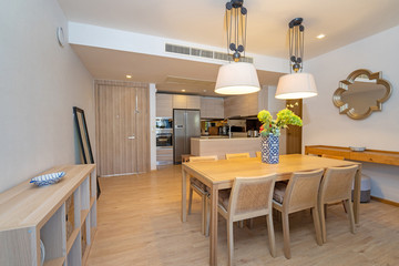Interior design in villa, house, home, condo and apartment feature wooden dining table, dining chair and kitchenette