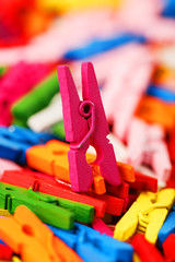 Colorful Wooden clothespins close-up as texture and background.