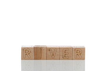 Wooden cubes with letters river on a white background