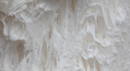 A splash of white paint. Abstract design abstract background. Macro texture and structure of white paint.