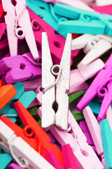 Colorful Wooden clothespins close-up as texture and background.