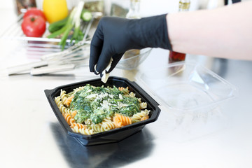 Meal prep. Box diet, healthy balanced meals. Appetizing pasta with spinach and cream cheese sauce.