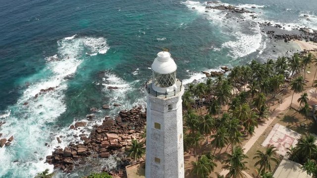 flying around the lighthouse in dondra sri lanka on a bright sunny day