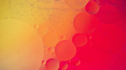Oil drops in water. Defocused abstract psychedelic pattern image red and orange colored. Abstract...