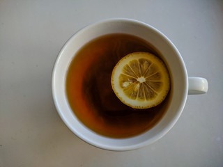 Tea with lemon on the table. View from above.