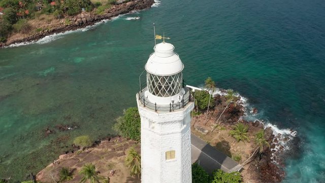 flying around the lighthouse in dondra sri lanka on a bright sunny day