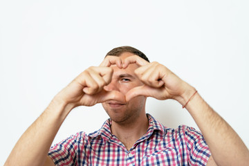 Naklejka premium man making a hand heart frame