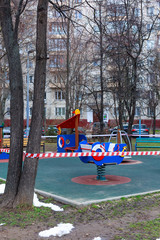 prohibited child play garden on a urban public park due to the coronavirus, covid-19 lockdown