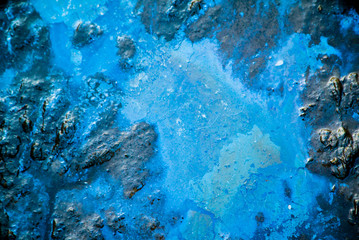 beautiful background of blue water dark brown earth.