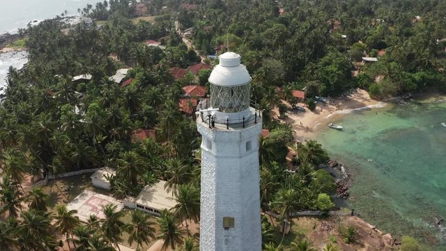 flying around the lighthouse in dondra sri lanka on a bright sunny day
