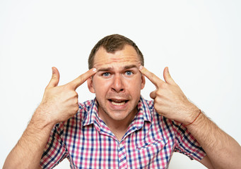 Fototapeta premium Closeup portrait of angry man gesturing with his finger against his temple, are you crazy?