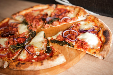Pizza Salsiccia with spicy sausage ,red onion , fior di latte and tomato sauce