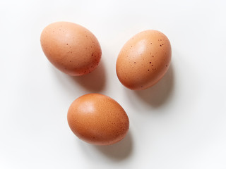 three eggs on white cove background