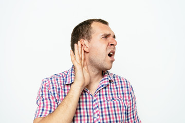 Overhears a man, tries to listen.