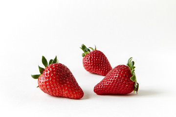  three strawberries on white Infinity cove background