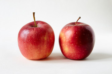 two red apples on white Infinity cove background
