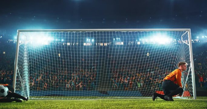 Goalkeeper splits in two and parries two balls out of the goal with flames and splashes animation on a professional soccer stadium. Stadium is made in 3d with animated crowd.