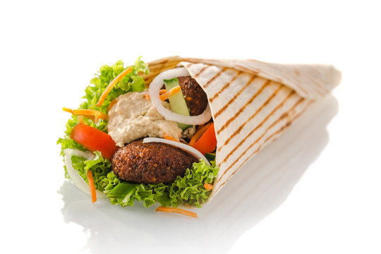 vegetarian tortilla wrap with falafel and hummus, isolated on white background