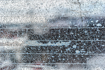 cracked glass texture. broken car window. cracked glass close up. vandalism of adolescents