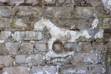 Old Silicate brick wall background. Broken plaster.