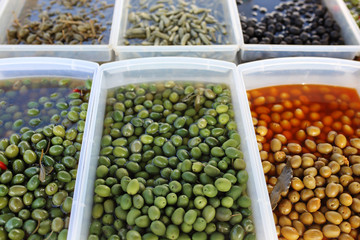 Olives, green olives, black olives. Market stall with olives. Natural food background.