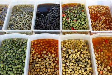 Olives, green olives, black olives. Market stall with olives. Natural food background.