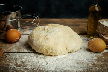 Pizza dough cooking in the home kitchen. Homemade dough for bread, pizza, pastries and rolls. Dough...
