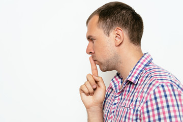 man put finger on her lips