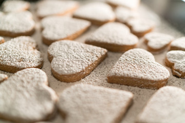 freshly baked heart-shaped cookies prepared on Mother's Day. Sugar, Cinnamon, and lots of love