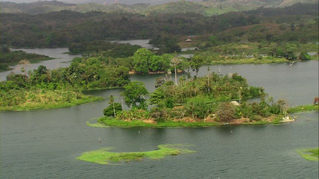 Aerial view of Lake Bayano, small islands with palms and cloud forest in Panama Central America, filmed with Cineflex stabilization camera system