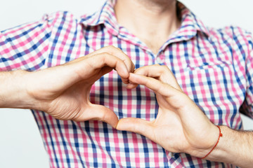 man making a hand heart frame