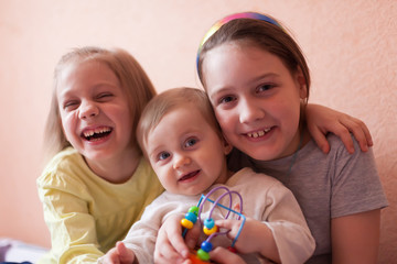 Portrait of three little sisters