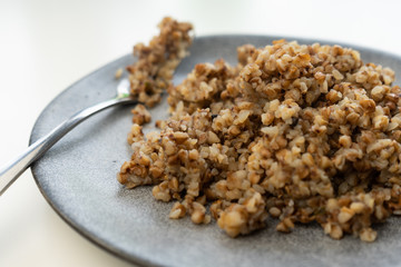 selective focus, cooked buckwheat on a plate