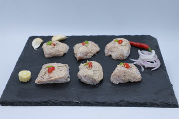 whole chicken merinated drumstick and boneless with sauce and spices on table