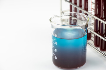 Methylene blue test liquid with blood sample for test, laboratory sample of blood testing for diagnosis virus infection, the pandemic infectious concept