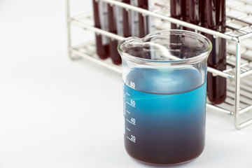 Methylene blue test liquid with blood sample for test, laboratory sample of blood testing for diagnosis virus infection, the pandemic infectious concept