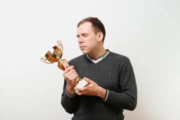 man with a golden cup