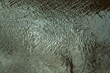 The ribbed surface of the water. The surface of the water with the wind