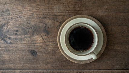 black coffee on wooden table. ceramic round cup. background