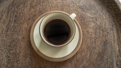 black coffee on wooden table. ceramic round cup. background