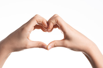 Kid hands forming a heart shape on white background