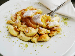 Kaiserschmarrn Austrian dessert traditional dish with scrambled pancakes and fruits