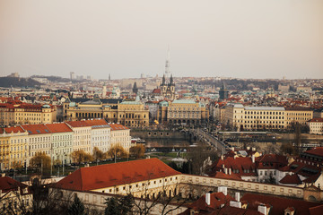 Rooftop view over historical center of Prague, Czech republic, EU. Tyn Church and Prague Castle. Red roofs and spires of historical Old Town of Prague. Copy space.